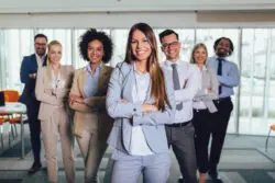 A group of diverse professionals posing together.